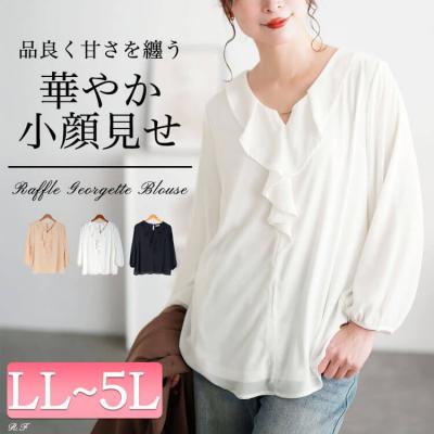 ゴールドパーツ付きラッフルブラウス